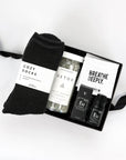 Cozy socks, detox bath salts, essential oil, breathe wipes in a curated gift box. Wellness gift boxes, custom client gifts, corporate gifting, employee gift boxes. 