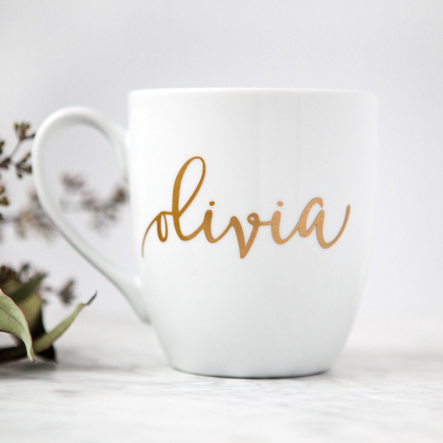 White mug with gold script name