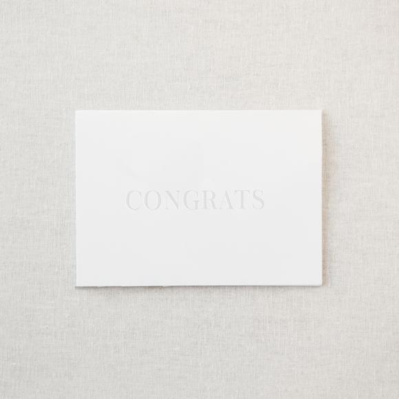 White greeting card with embossed &quot;congrats&quot;