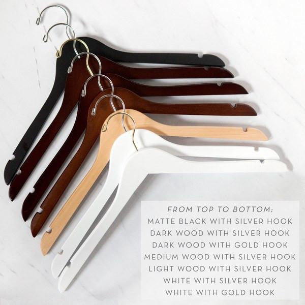 Hanger variation options. Matte black with silver hook, dark wood with silver hook, dark wood with gold hook, medium wood with silver hook, light wood with silver hook, white with silver hook, white with gold hook