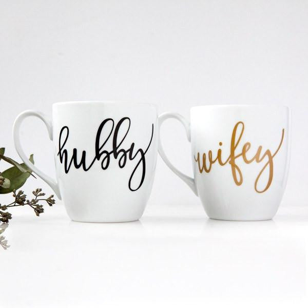 White ceramic mugs, two 15 oz mugs, &quot;hubby&quot; in black script font, &quot;wifey&quot; in gold script font