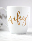 White ceramic mug, 15 oz , "wifey" in gold script font