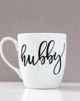 White ceramic mug, 15 oz , "hubby" in black script font