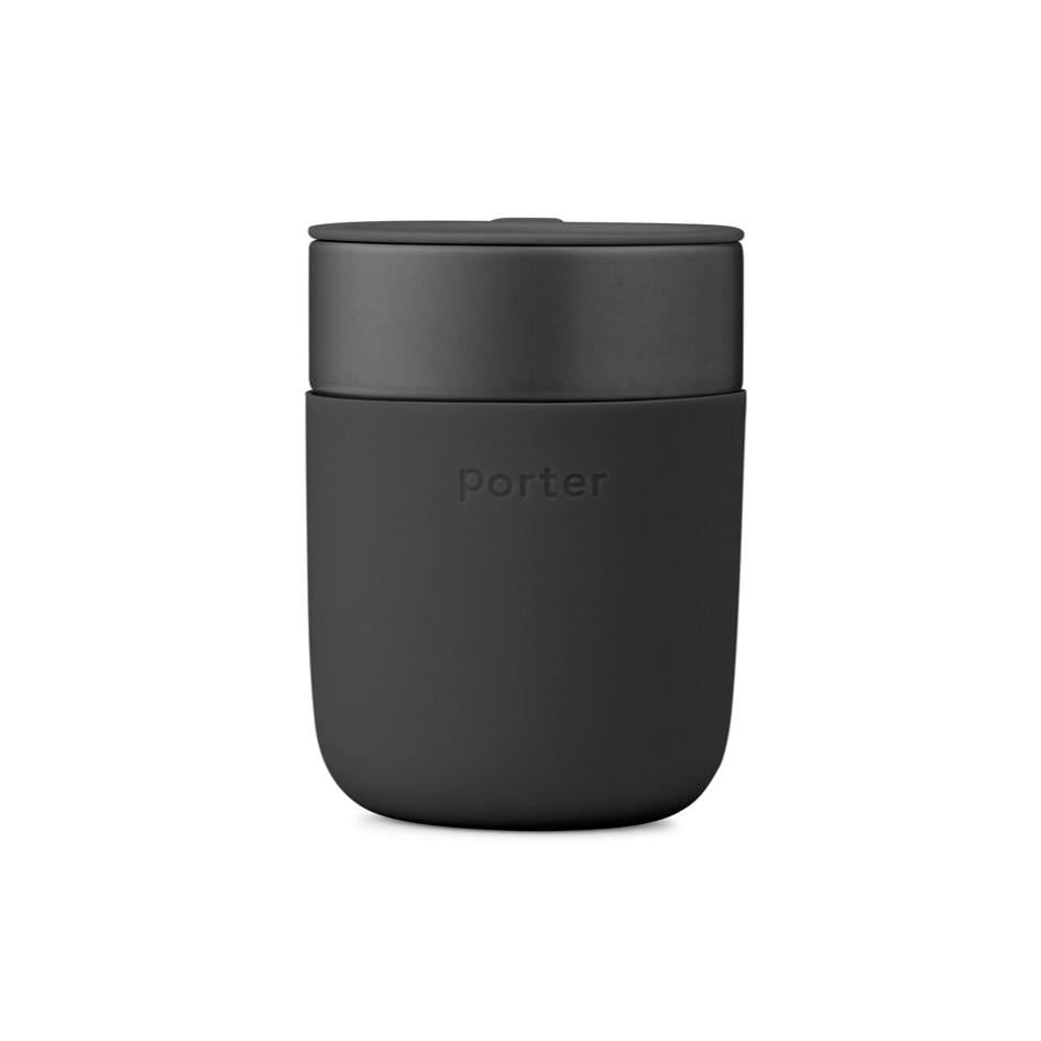 Black ceramic tumbler with protective black silicone sleeve.