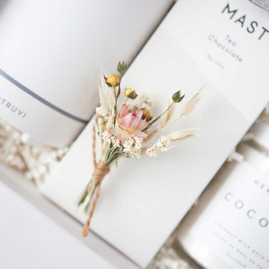 Close up of dried floral bundle tied with brown twine.