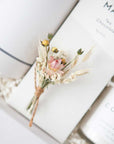 Close up of dried floral bundle tied with brown twine.