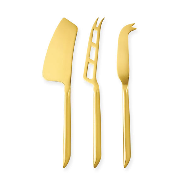 A Gold cleaver cheese knife next to a gold perforated, fork tipped cheese knife next to a fork tip spear cheese knife