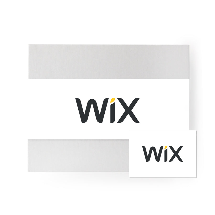 Gray &#39;foxblossom&#39; box with a white &#39;wix&#39; belly band, and a white post card with the same &#39;wix&#39; graphic printed on.